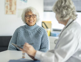 A doctor talks with her patient.