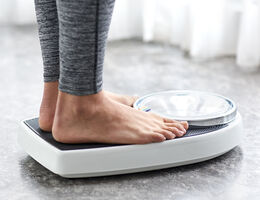 Feet on a bathroom scale.